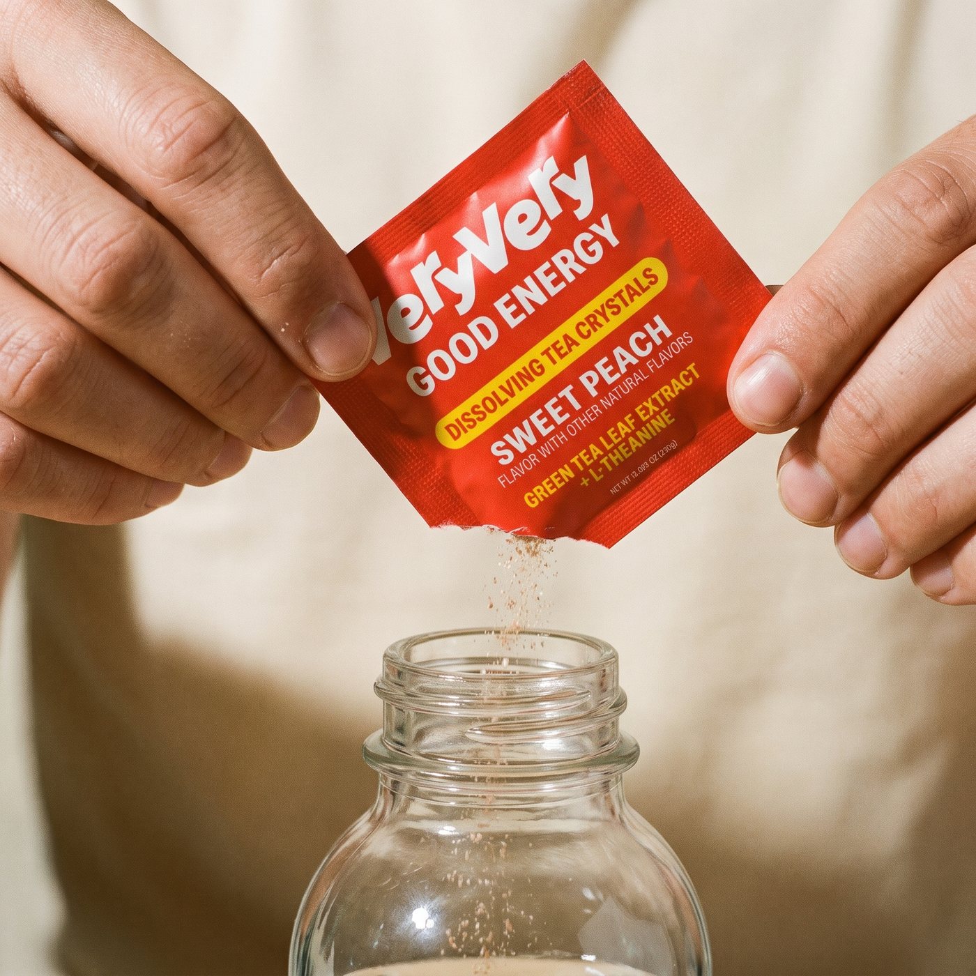 Tearing open a VeryVery sachet over a bottle