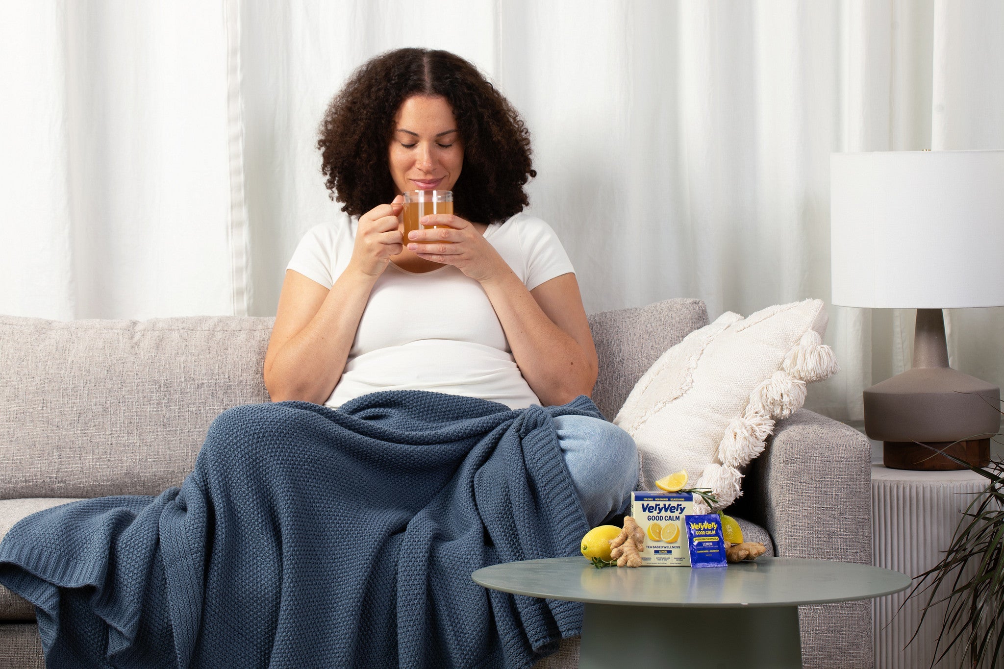 Lemon | Calming Tea Blend — Model relaxing on couch with tea
