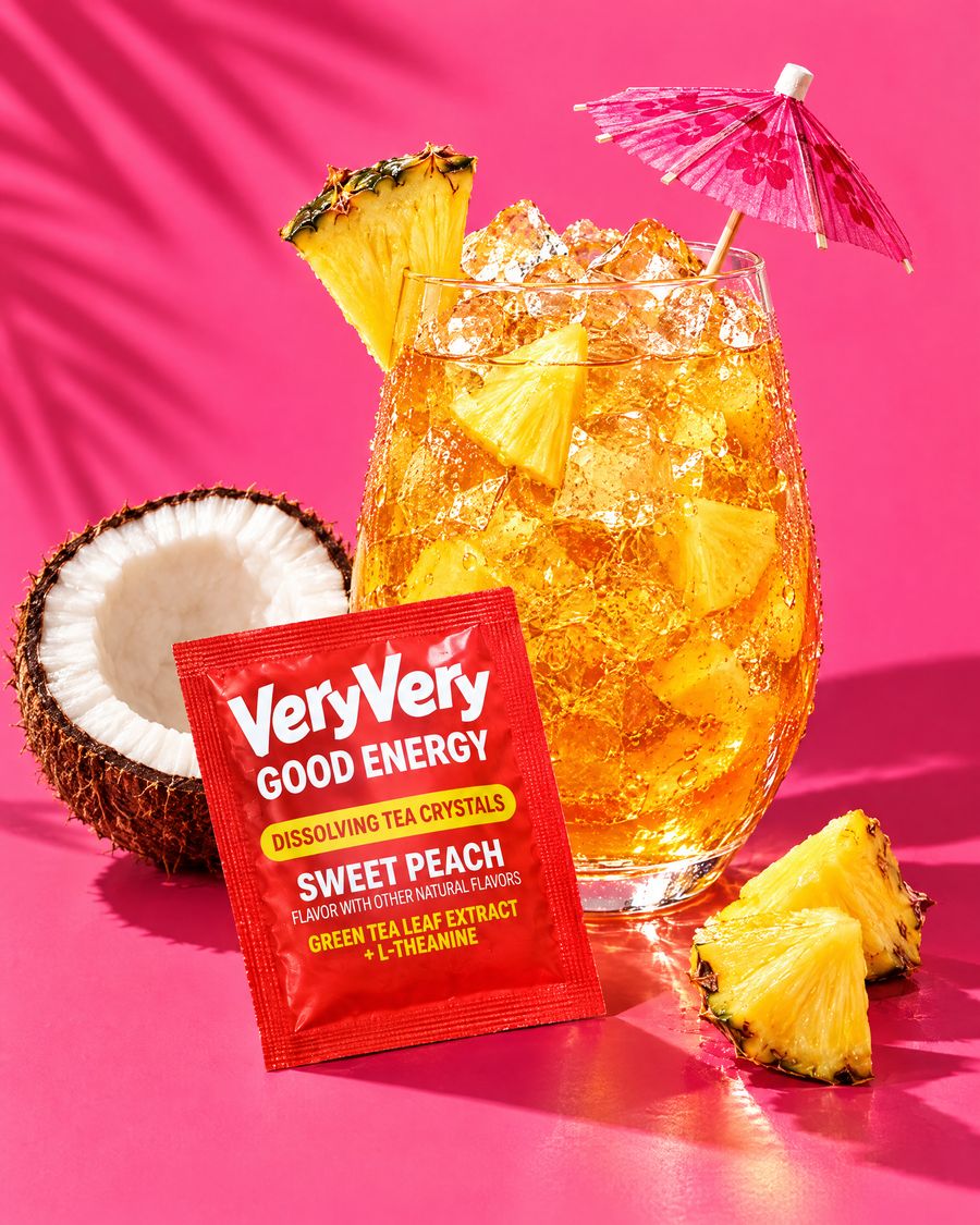 A glass of tropical tea with pineapple and an umbrella